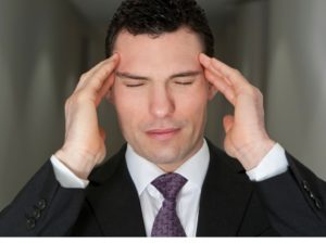 stress-management-training-exercises-businessman-touching-head